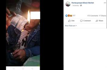 Beberapa nominal uang rupiah dibakar oleh orang ini. (Facebook/ Rantauprapat Black Market)